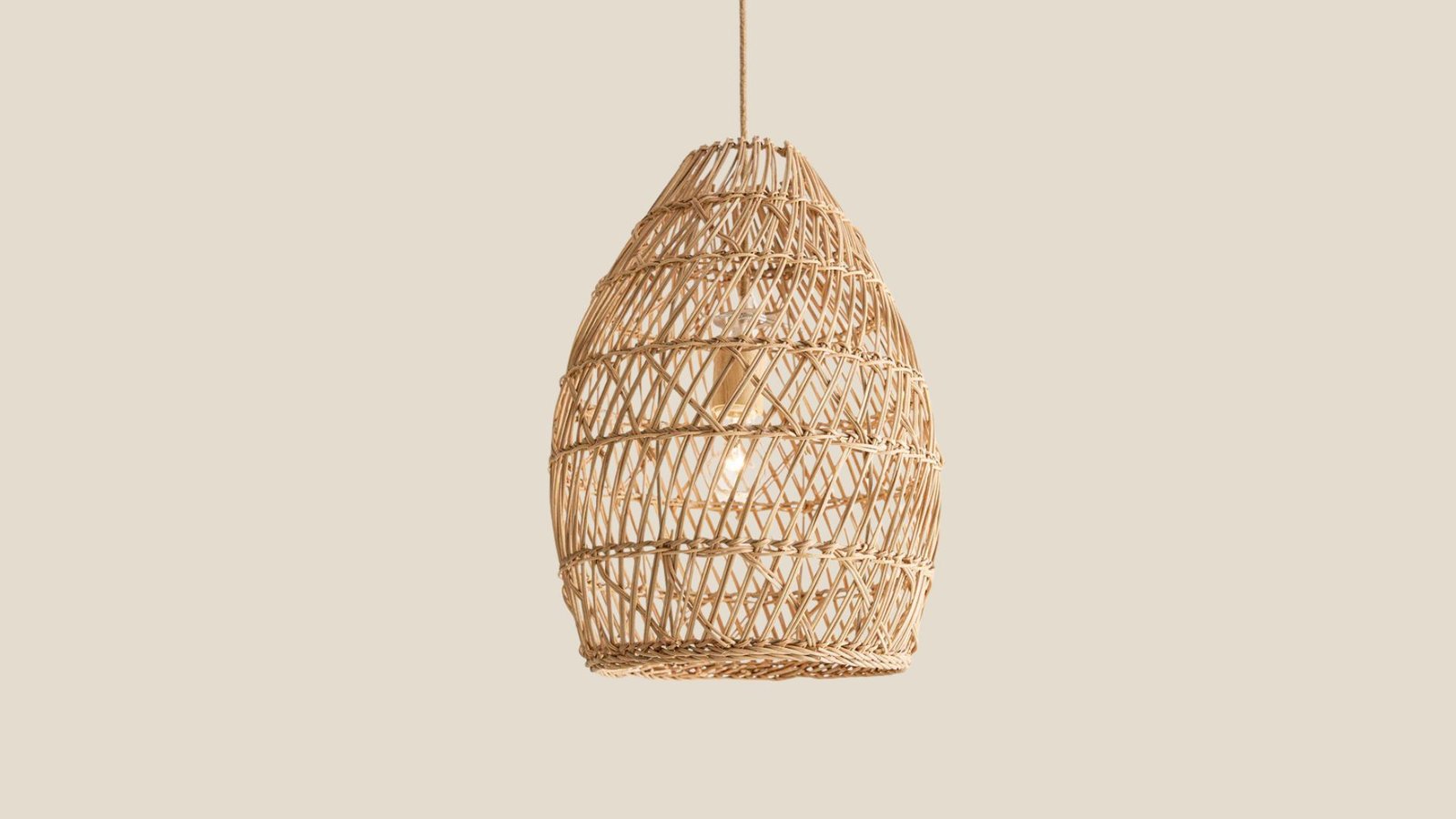 Callie Rattan Pendant Light installed in a naturally lit room